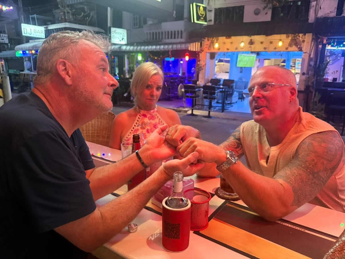 My friends Greg & Deb who have retired here - Greg and I sharing a bit of bro-mance - Deb not impressed!